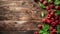 Fresh raspberries with green leaves on a rustic wooden background