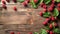 Fresh raspberries with green leaves on a rustic wooden background