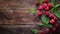 Fresh raspberries with green leaves on a rustic wooden background