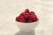 Fresh raspberries - tasty and healthy snack in the morning.Bowl of ripe fruit