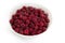 Fresh raspberries with water drops in white plate on a white background. Summer, sweet berry.