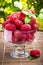 Fresh raspberry fruits in glass goblet