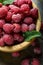 Fresh raspberry in a wooden plate