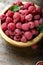 Fresh raspberry in a wooden plate