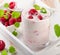 Fresh raspberry yogurt in a glass.