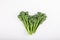 Fresh raw broccolini or baby broccoli on white background. Top view. Close-up. Copy space