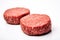 Fresh raw burger patties on a white background, created by Generative AI