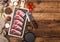 Fresh raw butchers lamb beef cutlets on chopping board with vintage meat hatchet and hammer on wooden background.Salt, pepper and