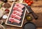 Fresh raw butchers lamb beef cutlets on chopping board with vintage meat hatchet and hammer on wooden background.Salt, pepper and