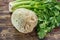 Fresh raw celeriac root head and celery green crisp petiole, ing