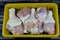 Fresh raw chicken legs drumsticks hindquarter with skin and bones that is ready for baking, grilling, barbecuing, frying or