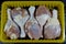 Fresh raw chicken legs drumsticks hindquarter with skin and bones that is ready for baking, grilling, barbecuing, frying or