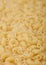 Fresh raw classic maccheroni elbows pasta ias texture background