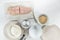 Fresh raw fish fillet and some ingredients, as eggs, flour, and bread crumbs close up on a kitchen table on white background