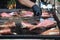 Fresh raw fish on grill slate, during seafood festival, street food market