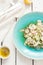 Fresh raw food diet salad - zucchini \'tagliatelle\', radish slices, roasted sunflower seeds