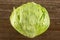 Fresh raw Iceberg Lettuce on brown wood