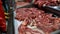 Fresh Raw Meat in a counter of market. Butcher shop. Pieces of freshly cut beef or pork meat on the showcase, close up