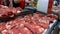 Fresh raw meat in a counter of market. Butcher shop. Pieces of freshly cut beef or pork meat on the showcase, close up