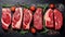 Fresh raw meat on slate black board top view, Variety of raw beef steak, spices, seasoning, herbs for cooking, grilling