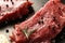 Fresh raw meat with spices on dark background, closeup