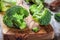 Fresh raw organic broccoli cutting board closeup