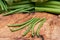 Fresh Raw Organic French Green Beans Haricot Verts, or Filet Beans on olive wood.