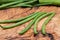 Fresh Raw Organic French Green Beans Haricot Verts, or Filet Beans on olive wood.