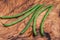 Fresh Raw Organic French Green Beans Haricot Verts, or Filet Beans on olive wood.