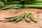 Fresh Raw Organic French Green Beans Haricot Verts, or Filet Beans on olive wood.