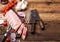 Fresh raw pieces of pork ribs on chopping board and vintage meat hatchets on wooden background. Fresh tomatoes and red onion with