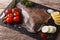 Fresh raw plaice with ingredients on a slate board. horizontal