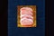 Fresh raw pork meat porcine steak blue cold black background top view four