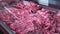 fresh raw pork meat in refrigerated display case, fresh organic food