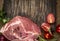 Fresh raw pork with tomatoes and onions on cutting board on wooden rustic background top view close up