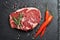 Fresh raw Prime Black Angus beef steak on stone background