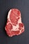 Fresh raw Prime Black Angus beef steak on stone background
