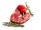 Fresh raw rib eye steak, red peppers and green rosemary leafs on white isolated surface. Meat industry product. Premium tender