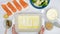 Fresh raw salmon fillet, cauliflower, broccoli, Alfredo sauce, and prepared baking dish for baked salmon, and vegetable casserole
