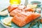 Fresh raw salmon or trout fillets with ingredients