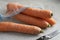 Fresh raw sweet winter carrots in a bag close up