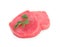 Fresh raw tuna fillets with parsley on white background