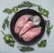 Fresh raw turkey fillet with butter and herbs titration tests on old cast iron pans Frame rustic wooden background top view