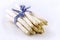 Fresh raw white asparagus bundle offered as close-up with ribbon