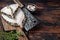 Fresh Raw wolffish o wolf fish Steak on a butcher board. Dark wooden background. Top view. Copy space