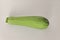 Fresh raw zucchini, courgette, Cucurbita  or squash vegetable marrow on a white background