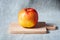 Fresh red apple on a wooden board. Cooking ingredient