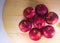 Fresh red apple on wooden table