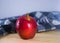 Fresh red apple on wooden table