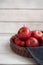 Fresh red apples in a wicker basket. Ripe fruits as a concept of a plentiful harvest. White background